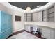 Stylish office space with custom built-ins, desk, and charming turquoise cabinet for ample storage and display at 3317 Oakmont Ter, Longwood, FL 32779