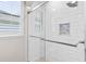New tile shower with glass door, shower caddy, and white subway tile at 3317 Oakmont Ter, Longwood, FL 32779