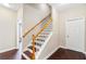 Beautiful staircase with dark wood treads and white risers at 3317 Oakmont Ter, Longwood, FL 32779