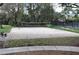 Community sand volleyball court with net ready for a game at 3317 Oakmont Ter, Longwood, FL 32779