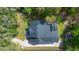 Aerial view of house with a pool and nice backyard, surrounded by lush greenery at 34 Jackson Cir, Winter Springs, FL 32708
