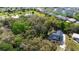 Stunning aerial view of home in a private, wooded lot near a pond at 34 Jackson Cir, Winter Springs, FL 32708