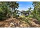 Spacious backyard featuring a screened patio with lush landscaping and privacy at 34 Jackson Cir, Winter Springs, FL 32708