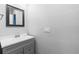 Bathroom features a gray vanity with undermount sink and ample countertop space at 34 Jackson Cir, Winter Springs, FL 32708