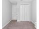 Minimal bedroom with carpet and built-in double closet, painted a serene gray color at 34 Jackson Cir, Winter Springs, FL 32708