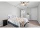Serene bedroom with a ceiling fan and carpet flooring with a dresser and bedside table for storage at 34 Jackson Cir, Winter Springs, FL 32708