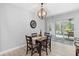 Cozy dining room with a table that seats four and a view of the pool and outdoor patio at 34 Jackson Cir, Winter Springs, FL 32708