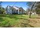 Inviting home featuring a well-manicured lawn and charming curb appeal at 34 Jackson Cir, Winter Springs, FL 32708