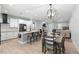 Bright open-concept living space with kitchen island, dining area, and fireplace, perfect for gatherings at 34 Jackson Cir, Winter Springs, FL 32708