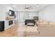 Bright living room featuring hardwood floors, fireplace, and modern furnishings for comfortable living at 34 Jackson Cir, Winter Springs, FL 32708