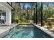 Sparkling pool surrounded by lush greenery and a screened enclosure at 34 Jackson Cir, Winter Springs, FL 32708