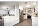 Bright, updated kitchen with stainless steel appliances, white cabinets, and an island open to living area at 3511 E Crystal Lake Ave, Orlando, FL 32806