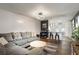 Comfortable living room featuring an open bar area, modern lighting, and cozy gray seating on a rug at 3511 E Crystal Lake Ave, Orlando, FL 32806