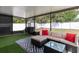 Outdoor patio with black furniture, a grill and a fenced yard with a hammock at 3511 E Crystal Lake Ave, Orlando, FL 32806