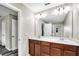 Bathroom features a double sink vanity with white countertops and a large mirror at 3661 Brighton Park Cir, Orlando, FL 32812