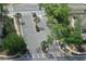 Gated community entrance with lush trees and palm trees surrounding the entrance at 3661 Brighton Park Cir, Orlando, FL 32812