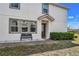 Welcoming home entrance with manicured landscaping and bench seating at 3661 Brighton Park Cir, Orlando, FL 32812