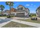 Beautiful two-story home featuring a two-car garage and brick-paved driveway at 3661 Brighton Park Cir, Orlando, FL 32812
