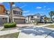 Well-maintained home featuring a two-car garage and landscaping at 3661 Brighton Park Cir, Orlando, FL 32812