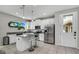 Bright kitchen featuring stainless steel appliances and a center island with seating at 3661 Brighton Park Cir, Orlando, FL 32812