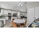 Bright kitchen featuring granite countertops, stainless appliances, and open floorplan at 3661 Brighton Park Cir, Orlando, FL 32812