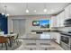 Stylish kitchen featuring granite countertops, stainless steel appliances, and a dining area at 3661 Brighton Park Cir, Orlando, FL 32812
