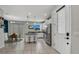 Open kitchen with a granite island, stainless appliances, and a breakfast nook at 3661 Brighton Park Cir, Orlando, FL 32812