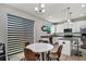 Bright eat-in kitchen featuring white cabinets, granite countertops, and stainless steel appliances at 3661 Brighton Park Cir, Orlando, FL 32812