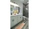 Modern bathroom featuring double vanity, sleek fixtures, and a glass-enclosed shower, offering a spa-like experience at 4634 Sw 170Th Road, Ocala, FL 34473
