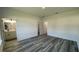 Empty bedroom with ensuite bathroom featuring neutral paint, recessed lighting, and wood flooring at 4634 Sw 170Th Road, Ocala, FL 34473