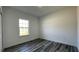 Bright bedroom featuring a window, fresh paint, and plank flooring at 4634 Sw 170Th Road, Ocala, FL 34473
