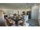 Open concept dining room flows to the modern kitchen, complete with stainless steel appliances at 4634 Sw 170Th Road, Ocala, FL 34473