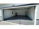 A spacious garage with high ceilings and painted floors at 4634 Sw 170Th Road, Ocala, FL 34473
