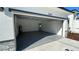 A spacious garage with high ceilings and painted floors at 4634 Sw 170Th Road, Ocala, FL 34473