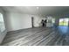 Spacious living area showcases sleek wood floors and an open concept design, ideal for entertaining guests at 4634 Sw 170Th Road, Ocala, FL 34473