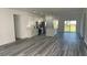 Spacious open-concept kitchen and living area featuring stainless appliances, an island, and wood look flooring at 4634 Sw 170Th Road, Ocala, FL 34473