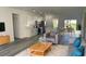 Modern living space with an open-concept layout, stainless appliances, kitchen island, and modern furnishings at 4634 Sw 170Th Road, Ocala, FL 34473