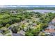 Aerial view of the community displaying mature trees and residences near a large lake at 5345 Sunrise Blvd, Orlando, FL 32803