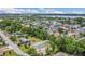 Community aerial view showcases mature trees, residences, and nearby lake views at 5345 Sunrise Blvd, Orlando, FL 32803