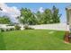 Spacious backyard featuring a well-maintained lawn and privacy fence, ideal for outdoor activities at 5345 Sunrise Blvd, Orlando, FL 32803