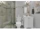 Bathroom with glass enclosed shower, vanity with cabinets, and gray paint at 5345 Sunrise Blvd, Orlando, FL 32803