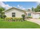 Charming single-story home with manicured lawn and lush landscaping at 5345 Sunrise Blvd, Orlando, FL 32803