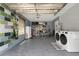 Spacious garage with epoxy flooring, a new washer and dryer, and shelving at 5345 Sunrise Blvd, Orlando, FL 32803