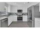 Stylish kitchen with stainless steel appliances, modern cabinets, and a sleek countertop at 5345 Sunrise Blvd, Orlando, FL 32803