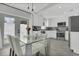Bright and modern kitchen with stainless steel appliances and white cabinetry at 5345 Sunrise Blvd, Orlando, FL 32803