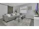 Cozy living room with a comfortable sectional sofa and a rustic sliding barn door at 5345 Sunrise Blvd, Orlando, FL 32803