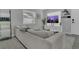 Comfortable living room features a plush sofa, a large window, and a modern TV set at 5345 Sunrise Blvd, Orlando, FL 32803