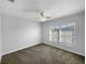 Neutral bedroom features a ceiling fan and a window letting in plenty of natural light at 5413 River Rock Rd, Lakeland, FL 33809