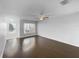 Bright bedroom with wood floors, ample natural light, and a ceiling fan, creating an airy and welcoming space at 5413 River Rock Rd, Lakeland, FL 33809
