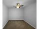Bedroom boasts carpeted floors and a ceiling fan for added comfort at 5413 River Rock Rd, Lakeland, FL 33809